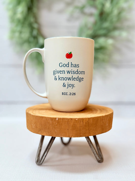 Back of mug with verse Ecc.2:26 and an apple on it.