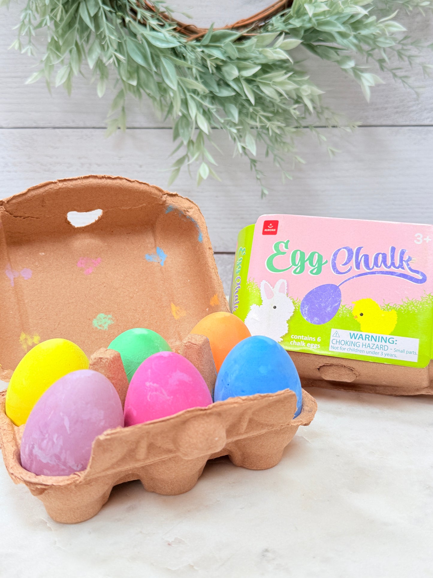 Easter egg shaped sidewalk chalk set in carton with bunny and chick design