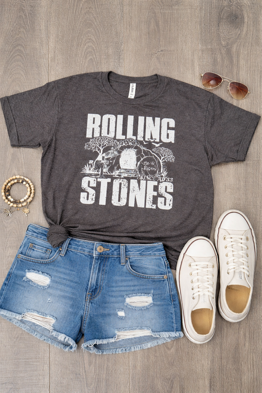 Charcoal Rolling Stones faith graphic tee with vintage tomb design styled with denim shorts and white sneakers flat lay