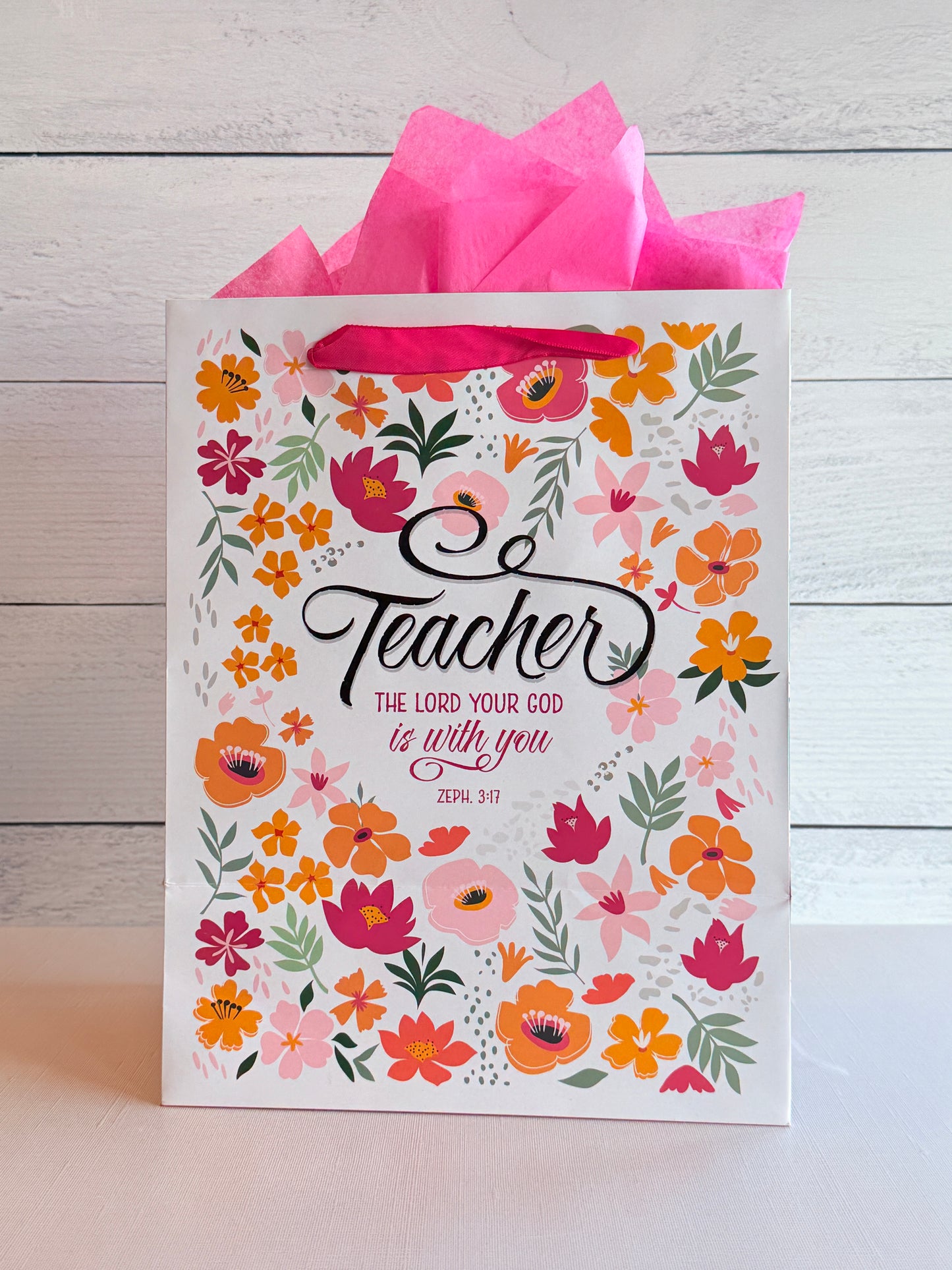 Floral teacher gift bag with colorful flowers and thank you teacher message, perfect for teacher appreciation gifts
