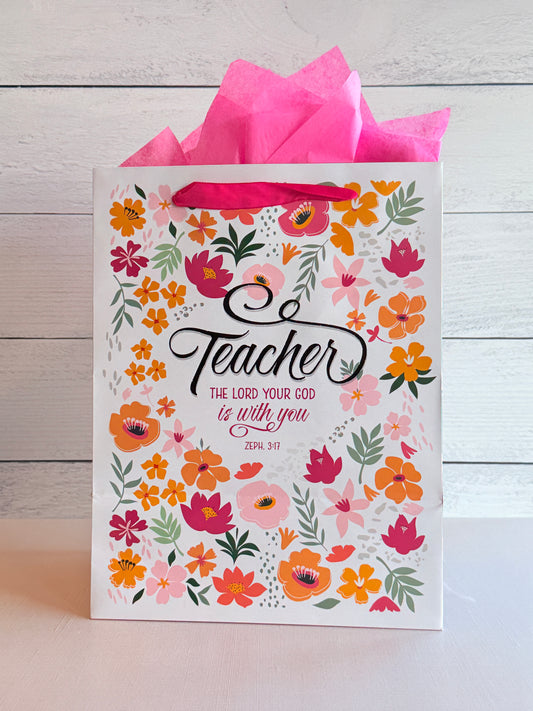 Floral teacher gift bag with colorful flowers and thank you teacher message, perfect for teacher appreciation gifts
