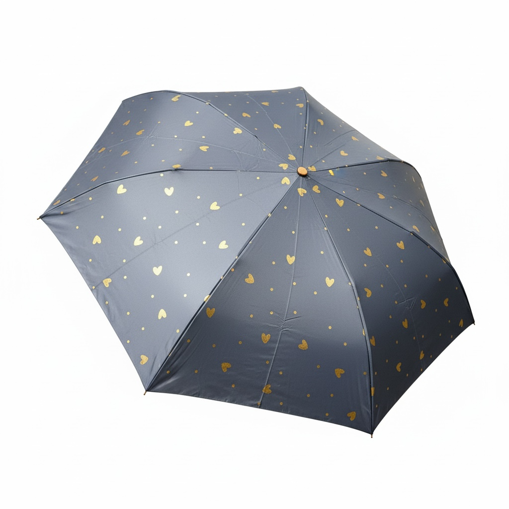 Dark blue umbrella with gold heart patterns on a white background