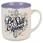 Be Still & Know ceramic coffee mug with purple floral design, lavender interior, gold rim, and Psalm 46:10 Scripture